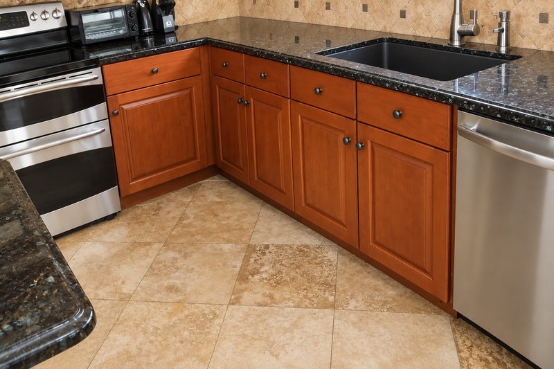 Cherry kitchen cabinets refinished with a hand-applied stain
